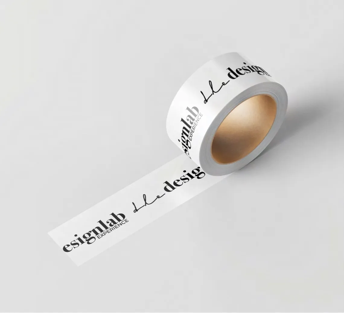 A roll of white packing tape printed with dle and designlab