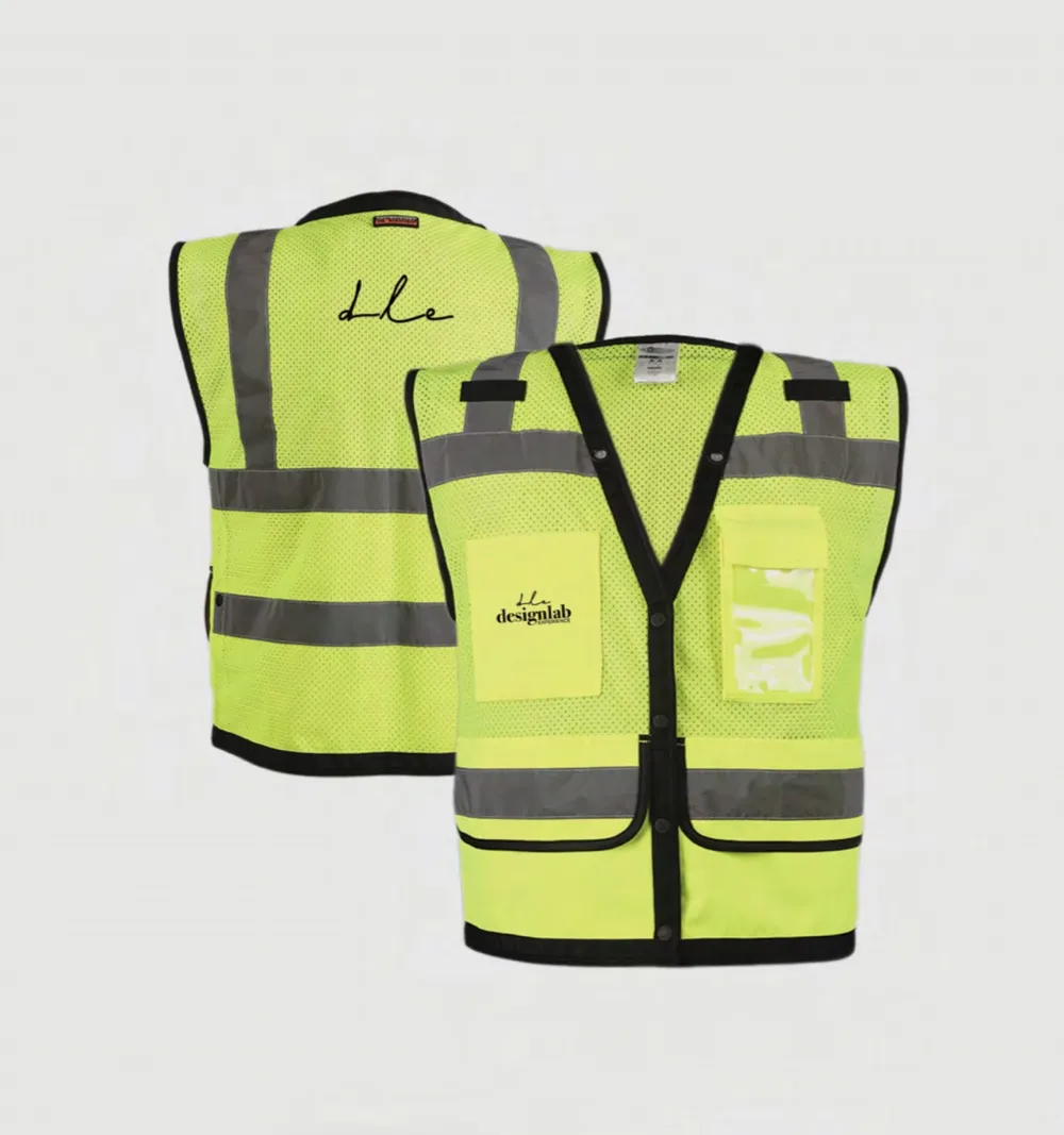 Two more vests: a large dle across the back of one, designlab on the pocket of the other